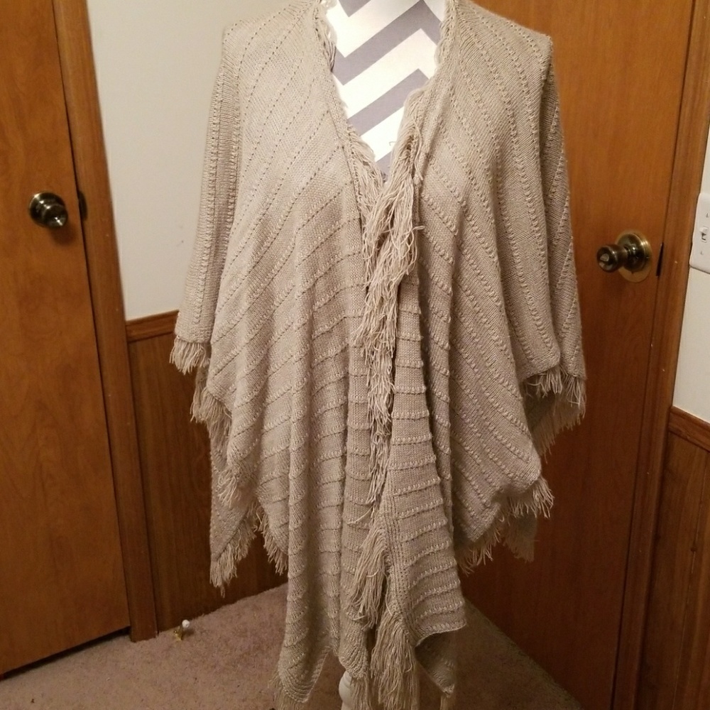 Cute comfy shaw greyish tan in color.